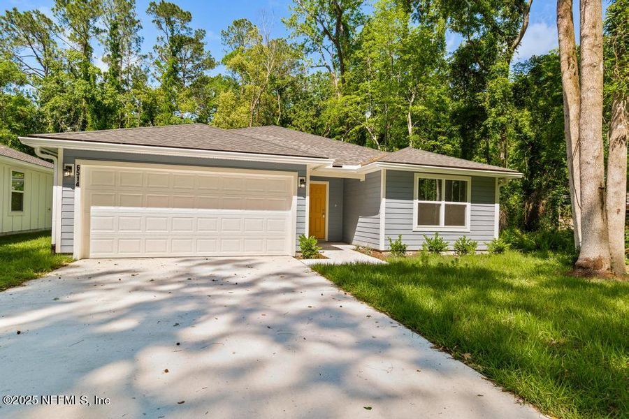 Front exterior of a new home in , Jacksonville, FL, highlighting curb appeal (Image 2).