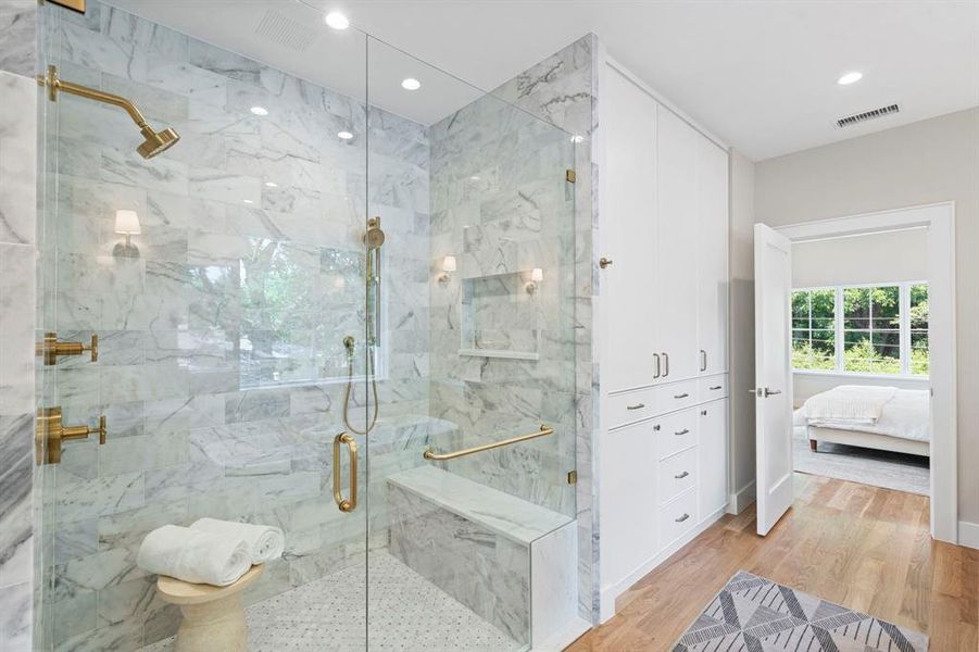 Bathroom featuring a shower with door and hardwood / wood-style floors