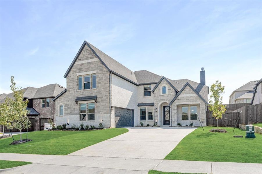 Front exterior of a new home in Ridgepoint, Midlothian, TX, highlighting curb appeal (Image 26).