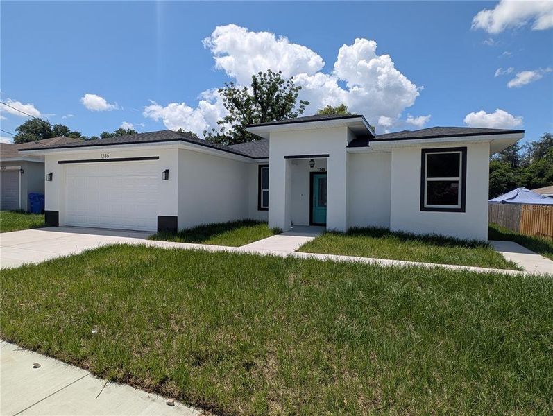 Front exterior of a new home in , Lakeland, FL, highlighting curb appeal (Image 1). Front exterior of a new home in , Lakeland, FL, highlighting curb appeal (Image 1).