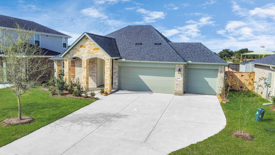 Front exterior of a new home in Sunrise Cove: Landmark Collection, Texas City, TX, highlighting curb appeal (Image 20).