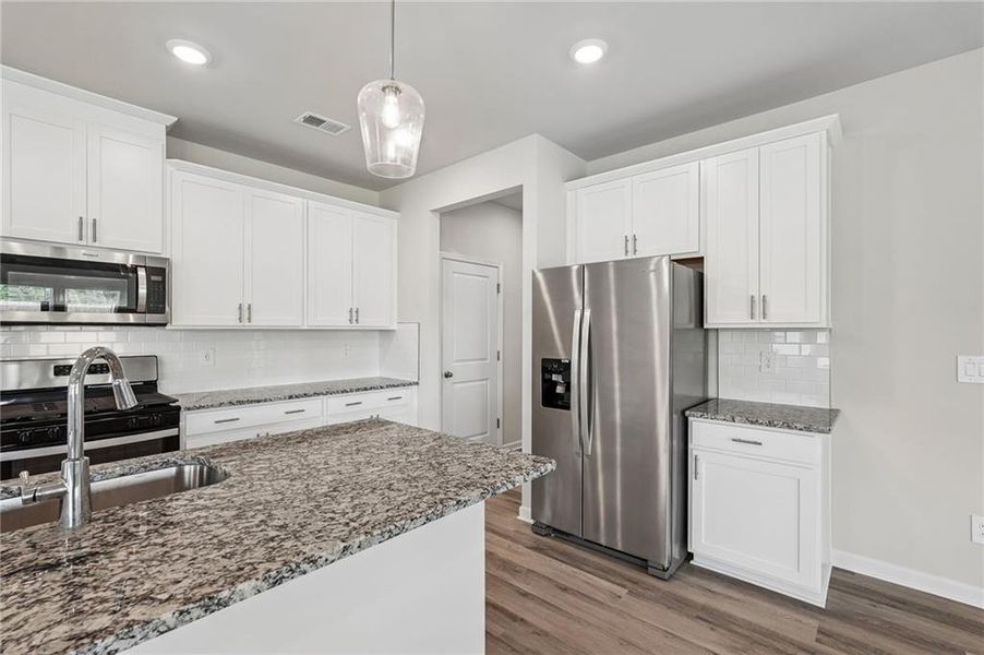Furnished interior view inside a new home in Northwoods at Mirror Lake, Villa Rica (Image 6).