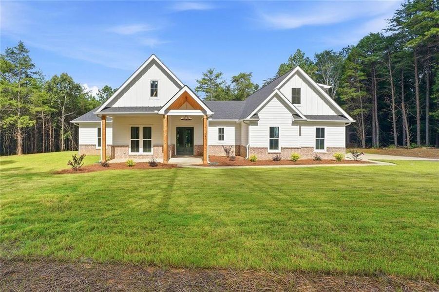 Front exterior of a new home in , White, GA, highlighting curb appeal (Image 1). Front exterior of a new home in , White, GA, highlighting curb appeal (Image 1).