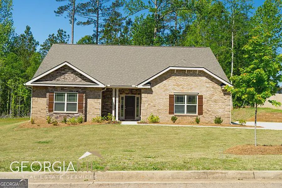 Front exterior of a new home in Holliday Pass, Griffin, GA, highlighting curb appeal (Image 1).