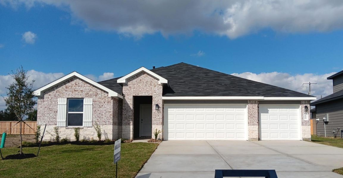 Front exterior of a new home in Medina, Dayton, TX, highlighting curb appeal (Image 1). Front exterior of a new home in Medina, Dayton, TX, highlighting curb appeal (Image 1).