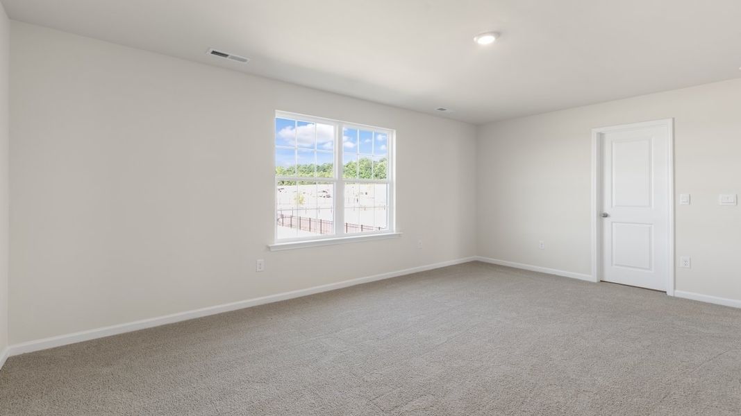 Spacious, unfurnished interior of a new home in The Grove at Matthews Landing, Fuquay Varina (Image 25).