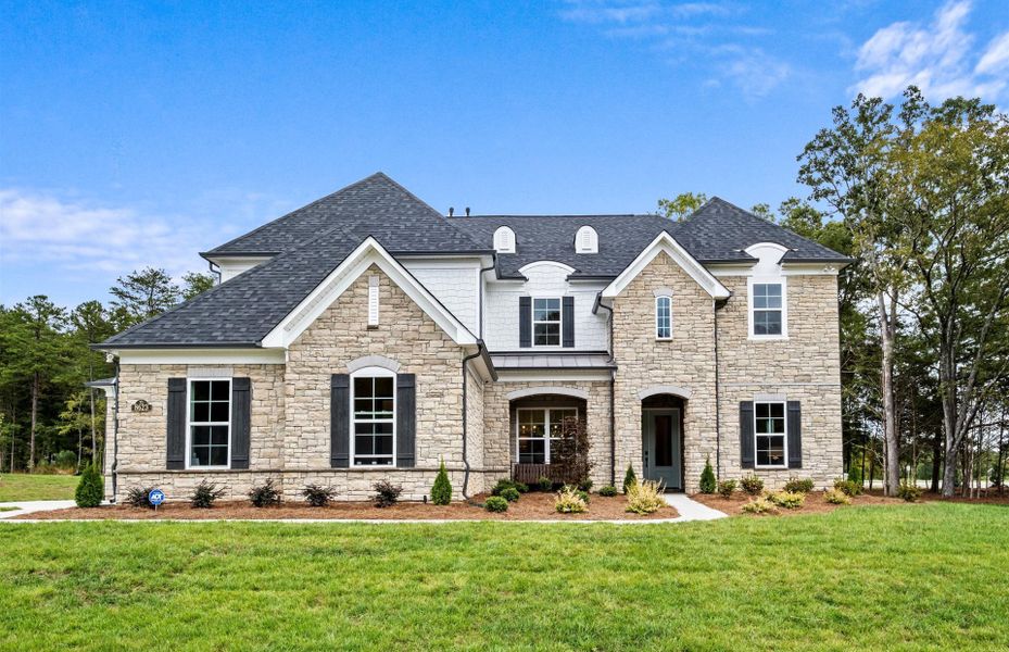 Front exterior of a new home in Olmsted, Huntersville, NC, highlighting curb appeal (Image 2). Front exterior of a new home in Olmsted, Huntersville, NC, highlighting curb appeal (Image 2).