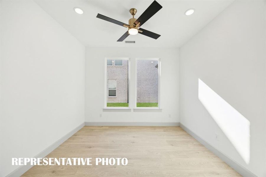 The professional needing to work from home will appreciate this light filled, private home office.  REPRESENTATIVE PHOTO