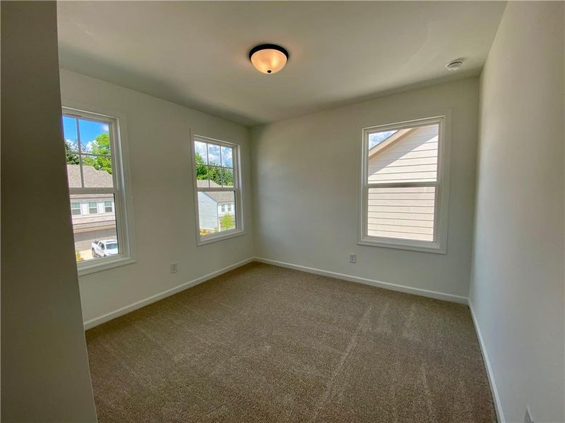 Spacious, unfurnished interior of a new home in Eastlyn Crossing, Flowery Branch (Image 24).