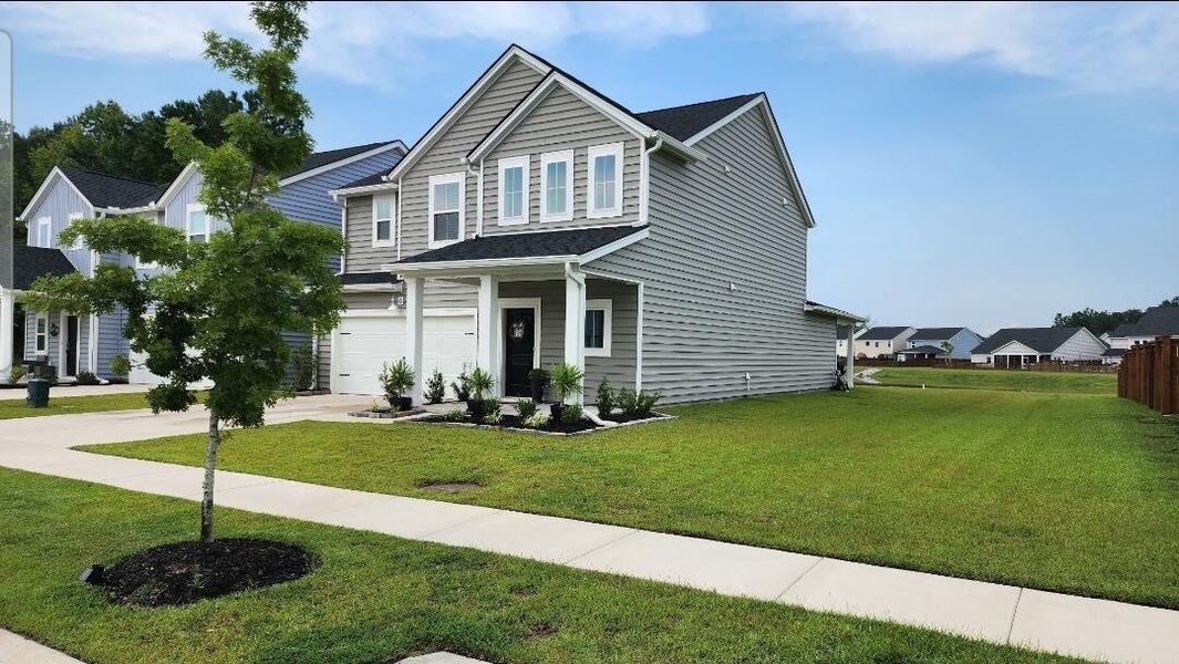 Front exterior of a new home in , Summerville, SC, highlighting curb appeal (Image 2). Front exterior of a new home in , Summerville, SC, highlighting curb appeal (Image 2).