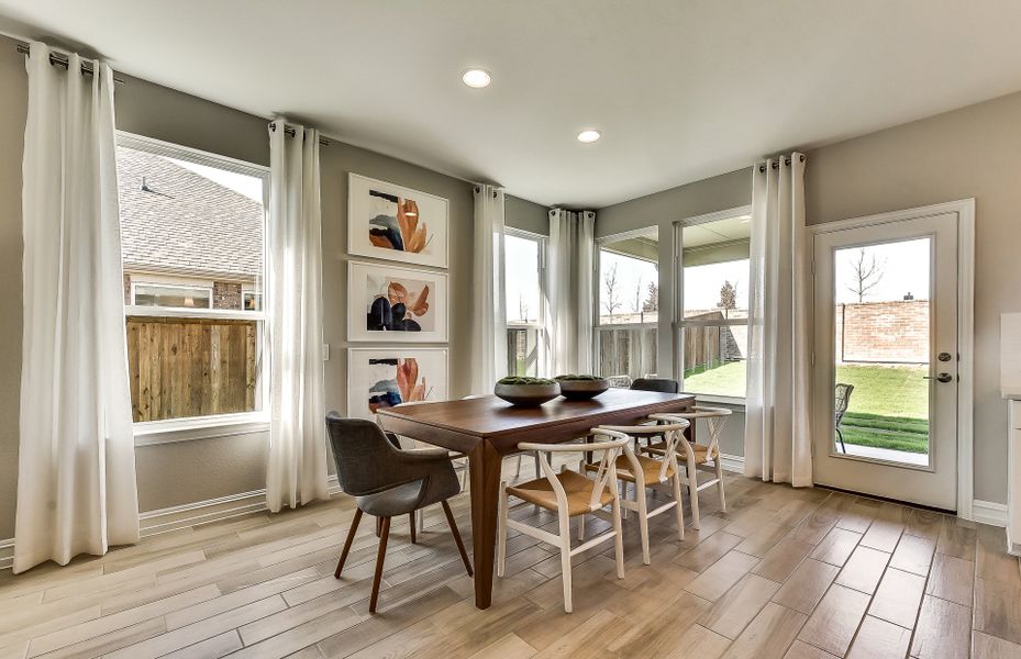 Dining area with large windows and access to cover