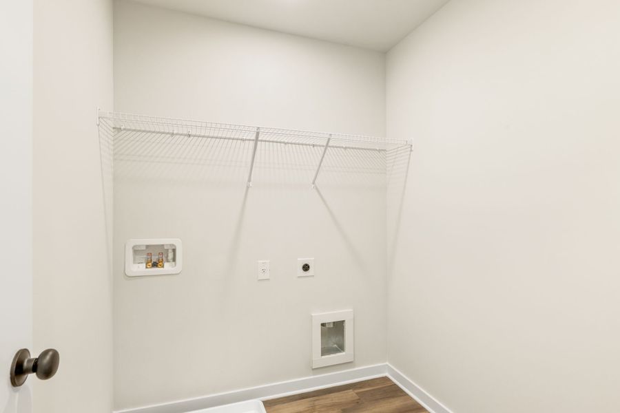 A white wall with a metal bar. A white wall with a metal bar.