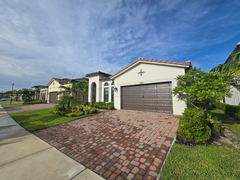 Front exterior of a new home in , Parkland, FL, highlighting curb appeal (Image 2). Front exterior of a new home in , Parkland, FL, highlighting curb appeal (Image 2).