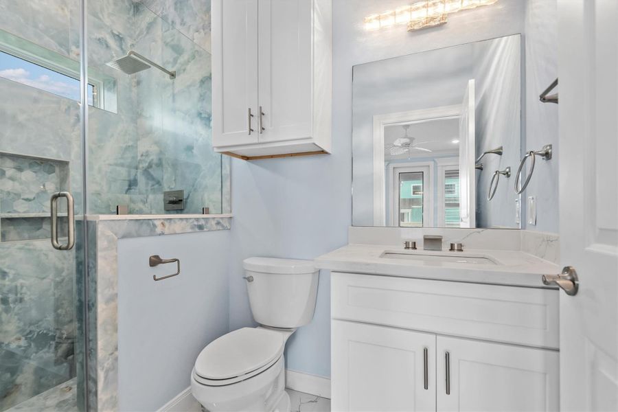 Primary on-suite bathroom with custom walk-in shower.