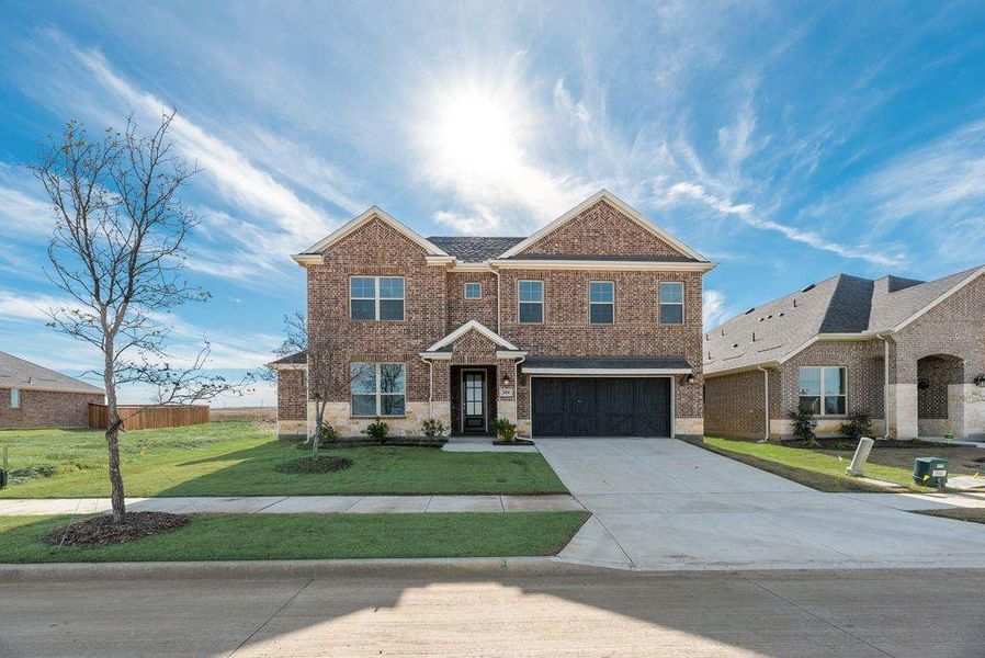Front exterior of a new home in Arbors at Legacy Hills, Celina, TX, highlighting curb appeal (Image 20).