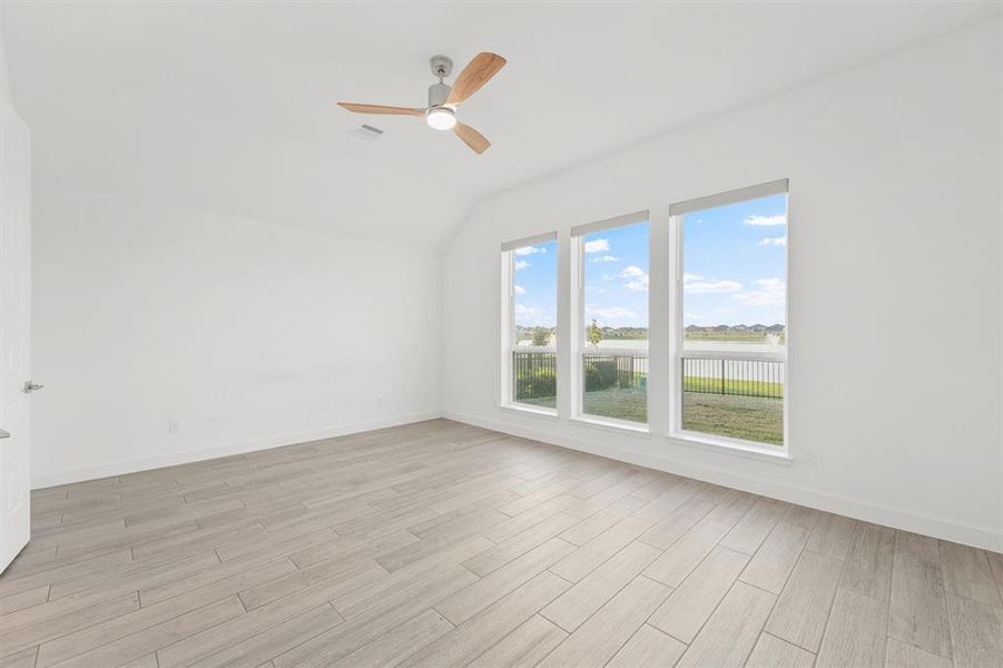 Primary Bedroom has Motorized Hunter Douglas Doulite Shades