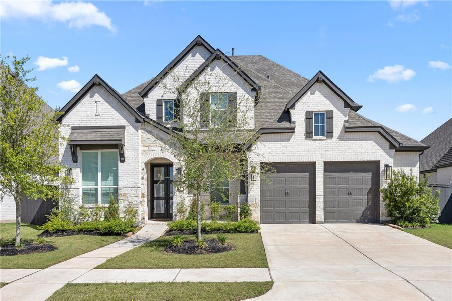 Front exterior of a new home in , Richmond, TX, highlighting curb appeal (Image 2). Front exterior of a new home in , Richmond, TX, highlighting curb appeal (Image 2).