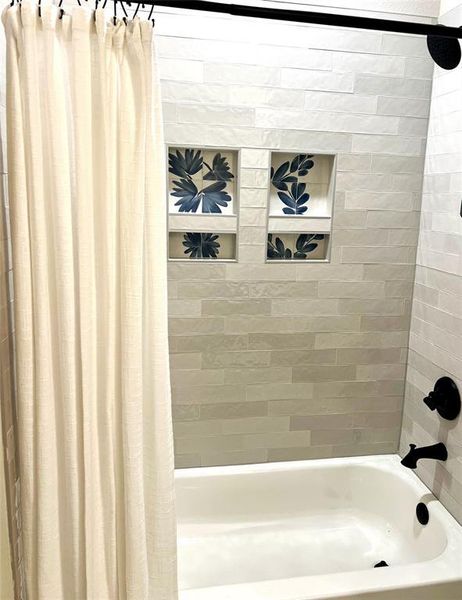 Bathroom with shower / bath combination with curtain Bathroom with shower / bath combination with curtain