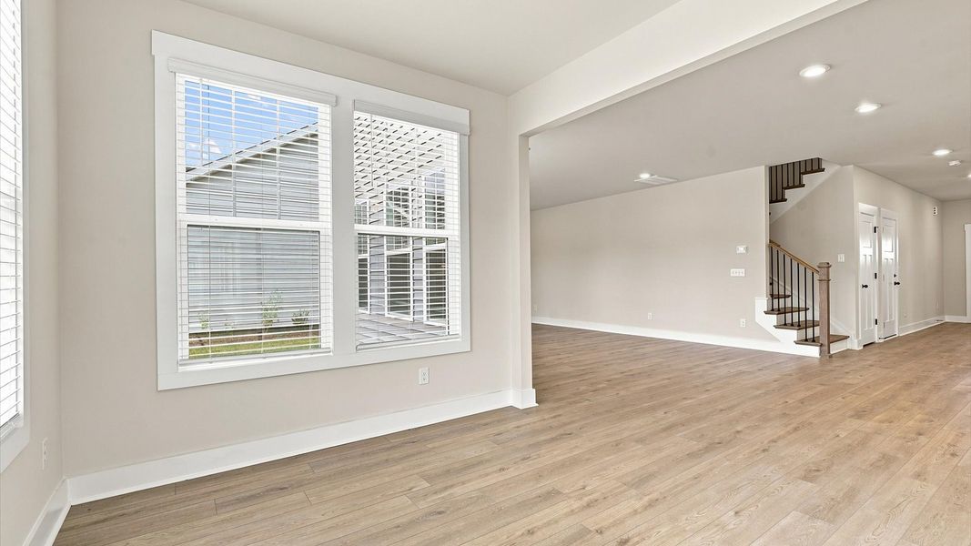 Light-filled breakfast nook offering a comfortable space to gather and unwind near Lake Bowen