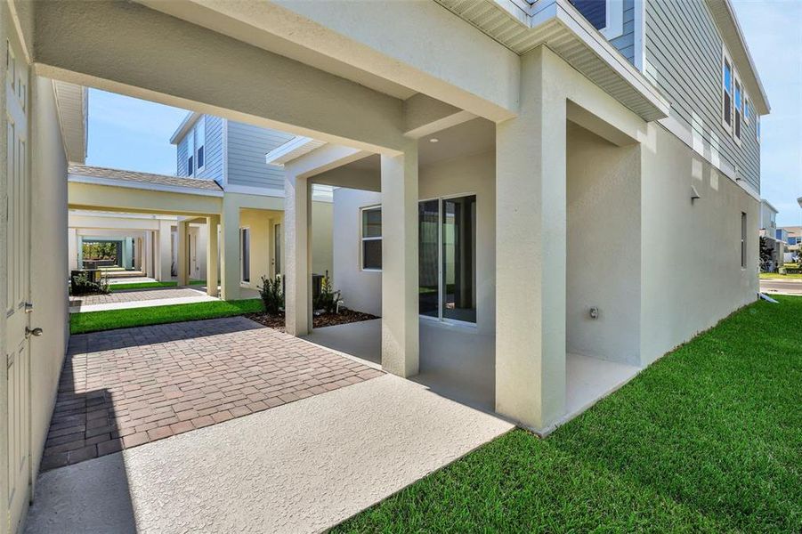 Exterior details and patio area of a home in Serenade at Ovation, Winter Garden (Image 3).