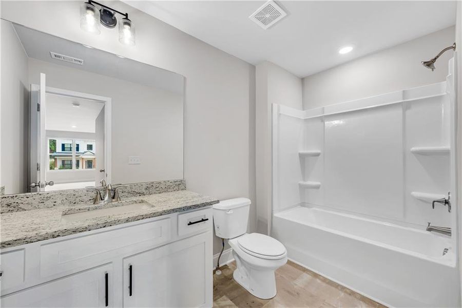 Furnished interior view inside a new home in Hidden Fields, Hoschton (Image 10).
