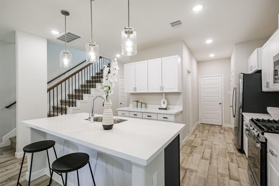 Photos are sample images from a previously built home with the same floor plan. Finishes and fixtures in the current home have been upgraded and may vary.