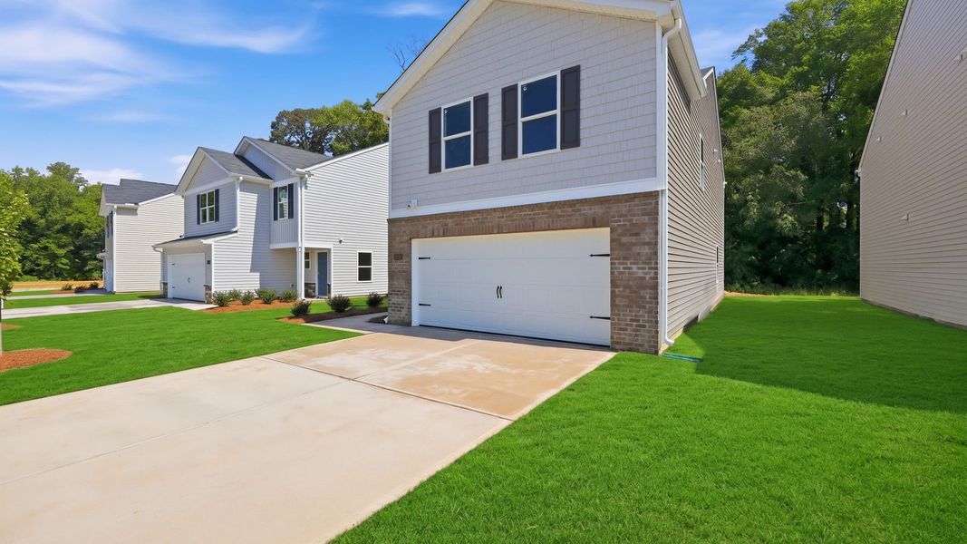 Front exterior of a new home in Carter Ridge, Greenville, NC, highlighting curb appeal (Image 22).