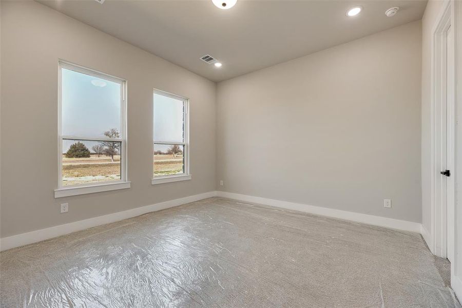 Unfurnished room with baseboards and recessed lighting