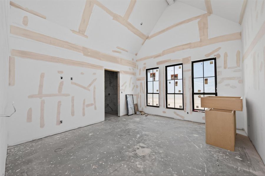 15'-6''x 17'-4'' guest suite with vaulted ceilings overlooking the front yard