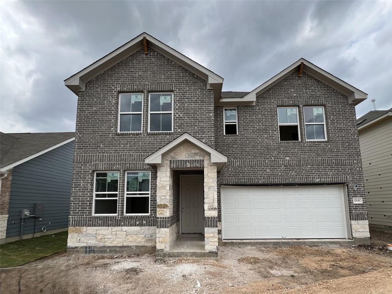 Front exterior of a new home in Rolling Glen, Hutto, TX, highlighting curb appeal (Image 13).