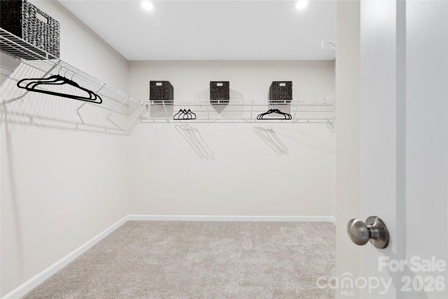 Large primary walk-in closet.