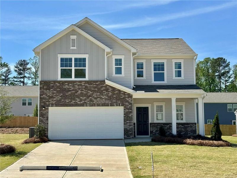 Front exterior of a new home in Mt. Tabor Ridge, Dallas, GA, highlighting curb appeal (Image 1). Front exterior of a new home in Mt. Tabor Ridge, Dallas, GA, highlighting curb appeal (Image 1).