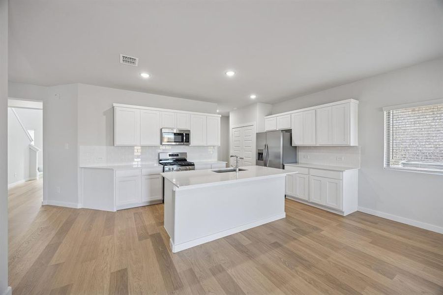 Kitchen in the Oak II home plan by Trophy Signature Homes – REPRESENTATIVE PHOTO