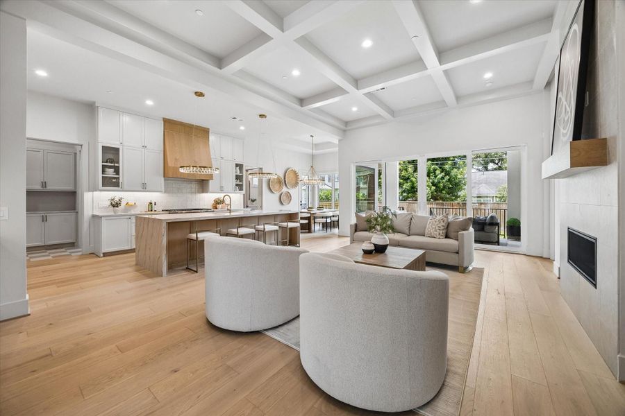 The living room is anchored by a beamed ceiling and hardwood floors, with an easy flow to the chef’s kitchen for everyday living and effortless entertaining. The living room is anchored by a beamed ceiling and hardwood floors, with an easy flow to the chef’s kitchen for everyday living and effortless entertaining.
