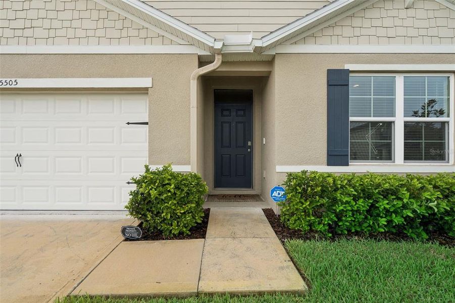 Exterior details and patio area of a home in Windrose, Apopka (Image 3).