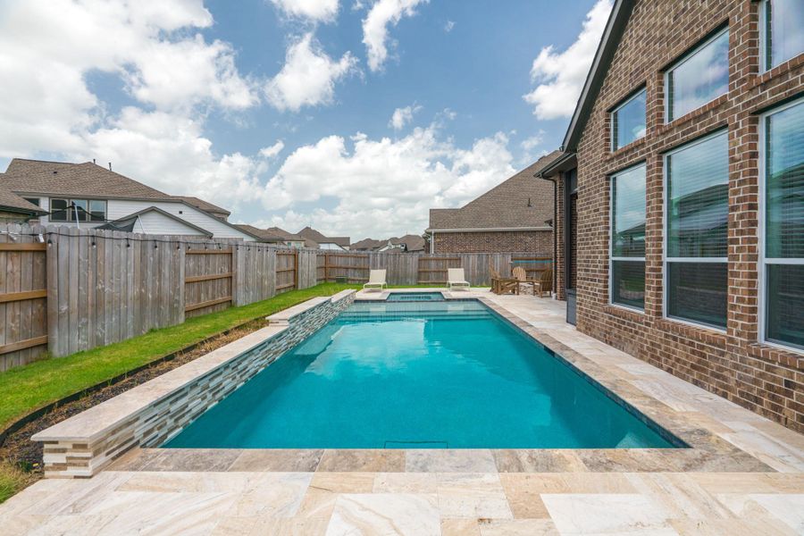 Enjoy Poolside Living in This Move-In Ready Home