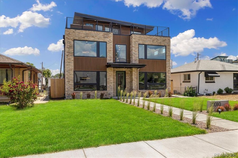 Front exterior of a new home in , Denver, CO, highlighting curb appeal (Image 2).