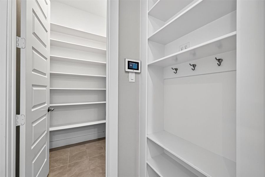 Pantry and mud area tucked away by the garage door.
