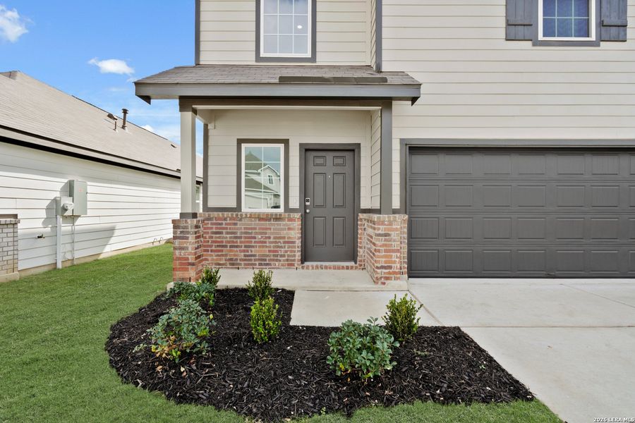 Exterior details and patio area of a home in Hickory Ridge, Elmendorf (Image 3).