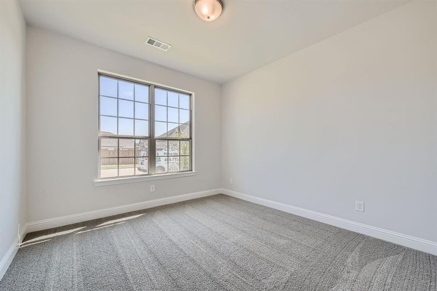 Empty room with carpet flooring