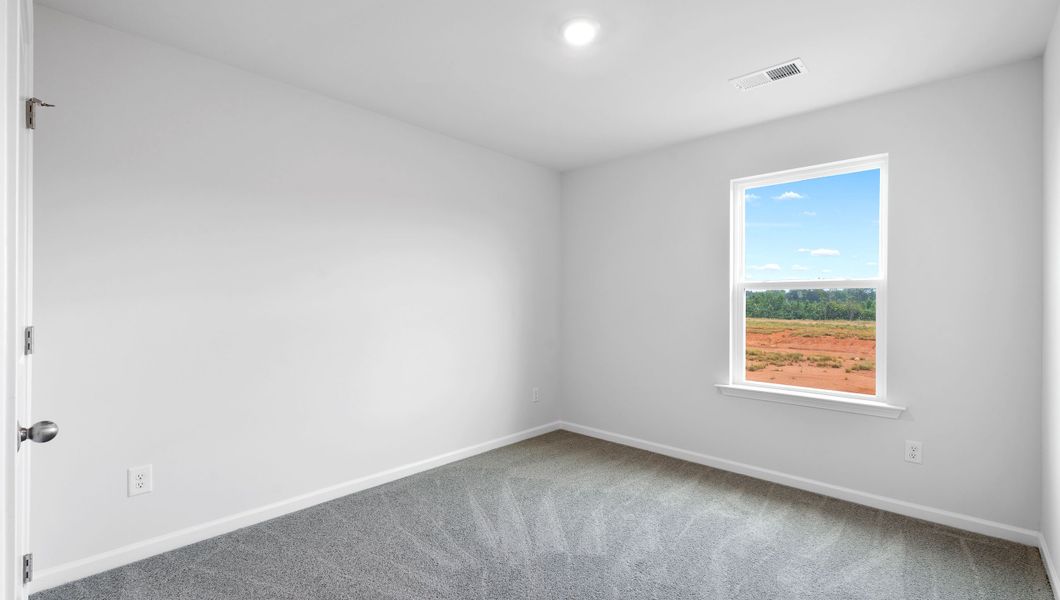 Representative unfurnished interior of a home built from the BELHAVEN by D.R. Horton in Benjamin's Grove, Woodruff (Image 28).