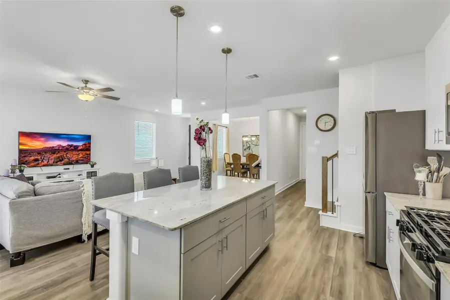 Bright and airy floor plan offering seamless connectivity between the kitchen, dining, and living spaces while maximizing natural light throughout.