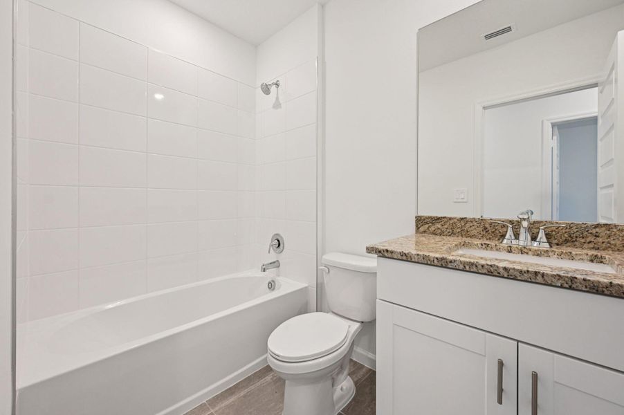 Furnished interior view inside a new home in Hampton Park - Classic Series, Vero Beach (Image 10). Furnished interior view inside a new home in Hampton Park - Classic Series, Vero Beach (Image 10).