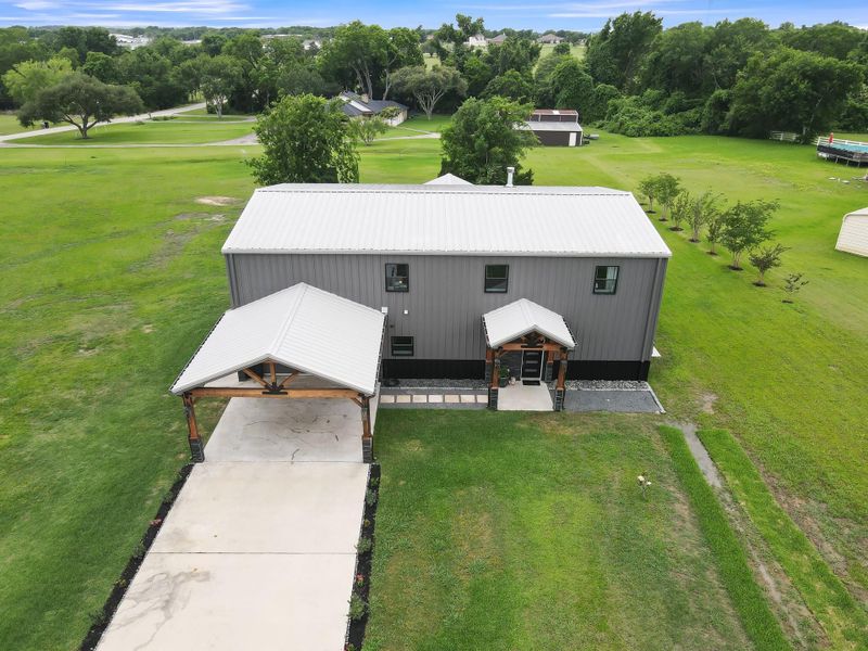 Extended 2 car garage and covered carport.