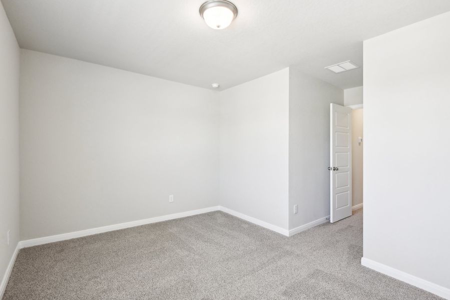 Guest bedroom in the Medina floorplan at a Meritage Homes community.