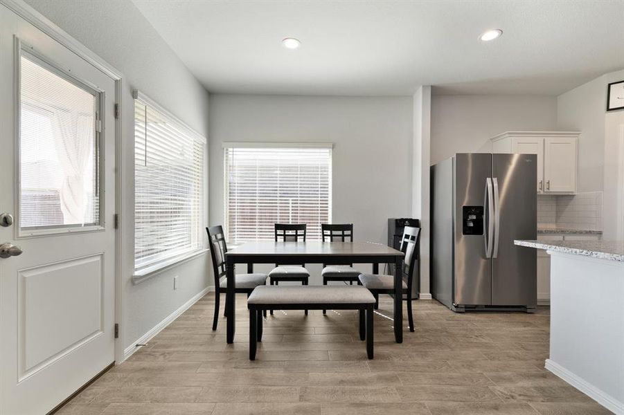 Dining space featuring recessed lighting and light wood finished floors