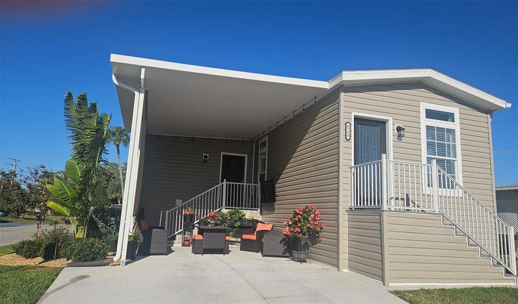 Exterior details and patio area of a home in , North Port (Image 25).