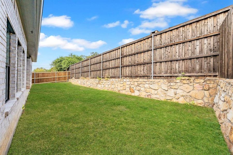 View of fenced backyard