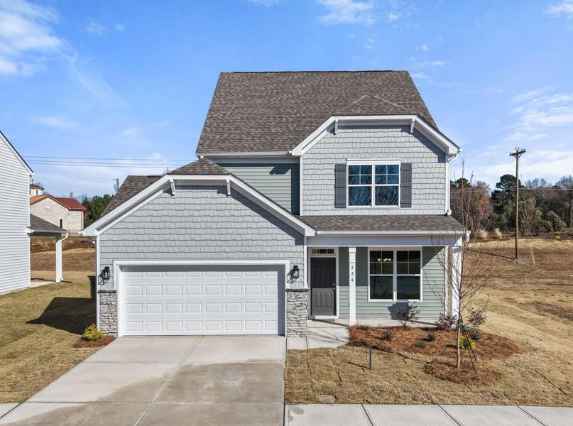 Front exterior of a new home in Monterra, Kernersville, NC, highlighting curb appeal (Image 1). Front exterior of a new home in Monterra, Kernersville, NC, highlighting curb appeal (Image 1).