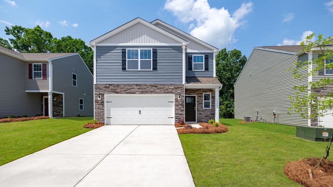 Front exterior of a new home in The Hamptons at Hickory, Hickory, NC, highlighting curb appeal (Image 1). Front exterior of a new home in The Hamptons at Hickory, Hickory, NC, highlighting curb appeal (Image 1).